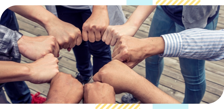 People form a circle by placing their hands in front of them
