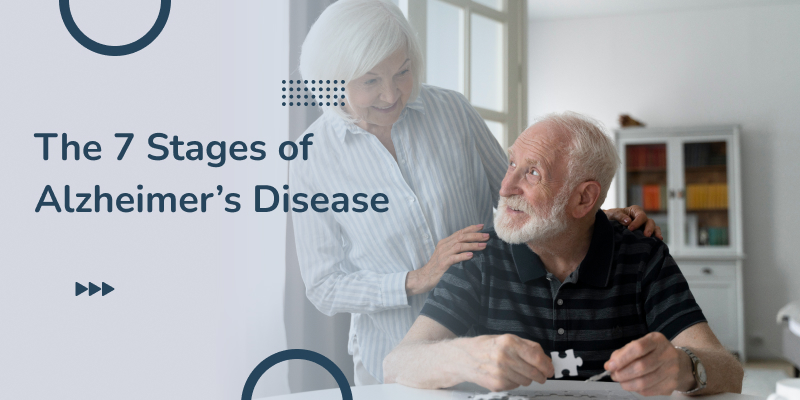 A caring woman assists a senior with Alzheimer's as he works on a puzzle.